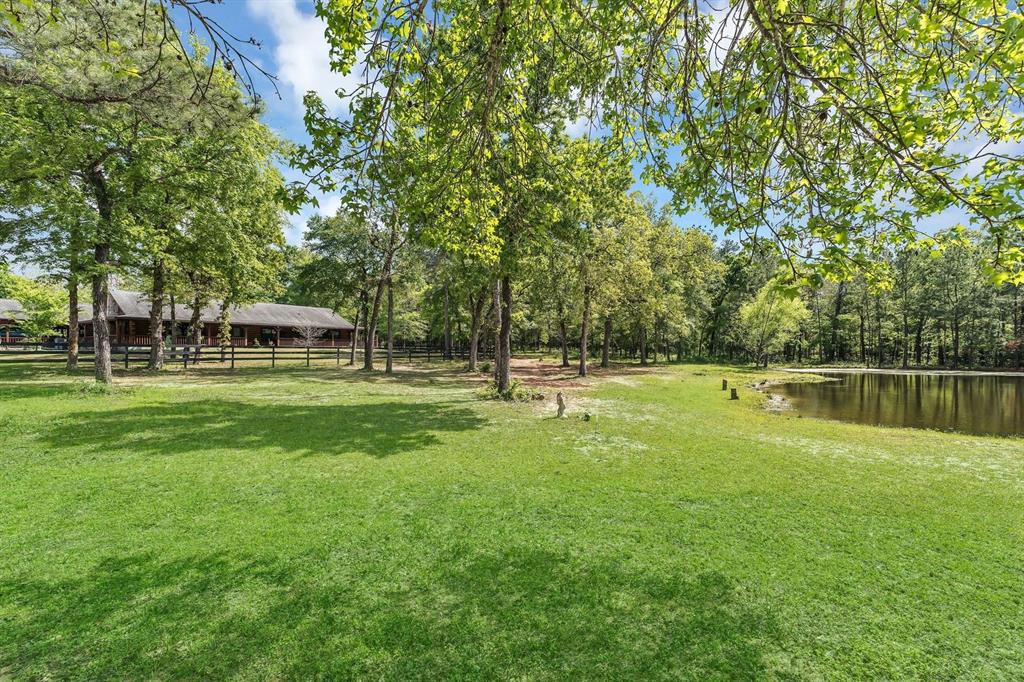 Nestled amongst the trees with a view of the pond sits this 3136 SF home