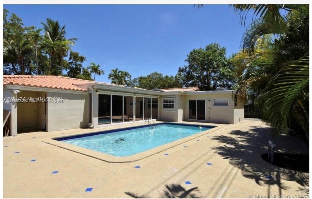 a view of a house with a swimming pool