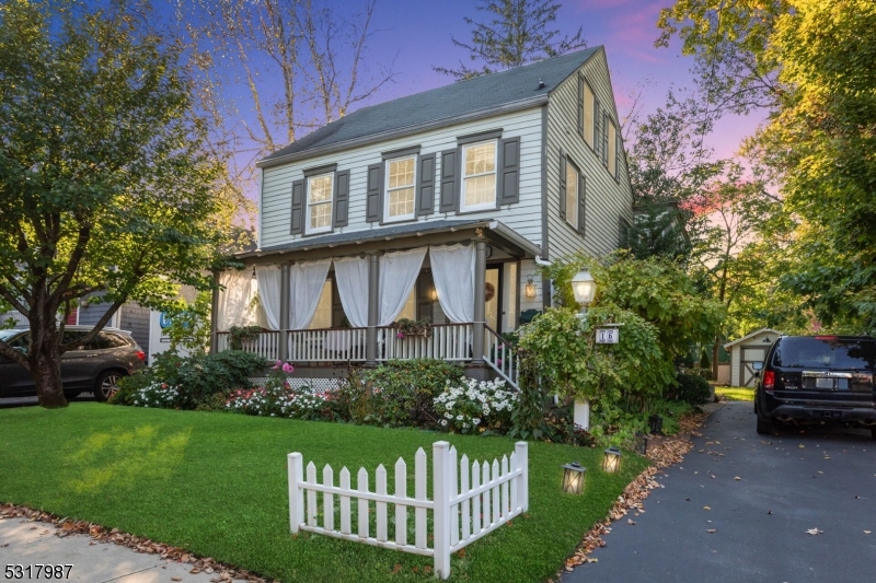 a view of a house with a yard and plants