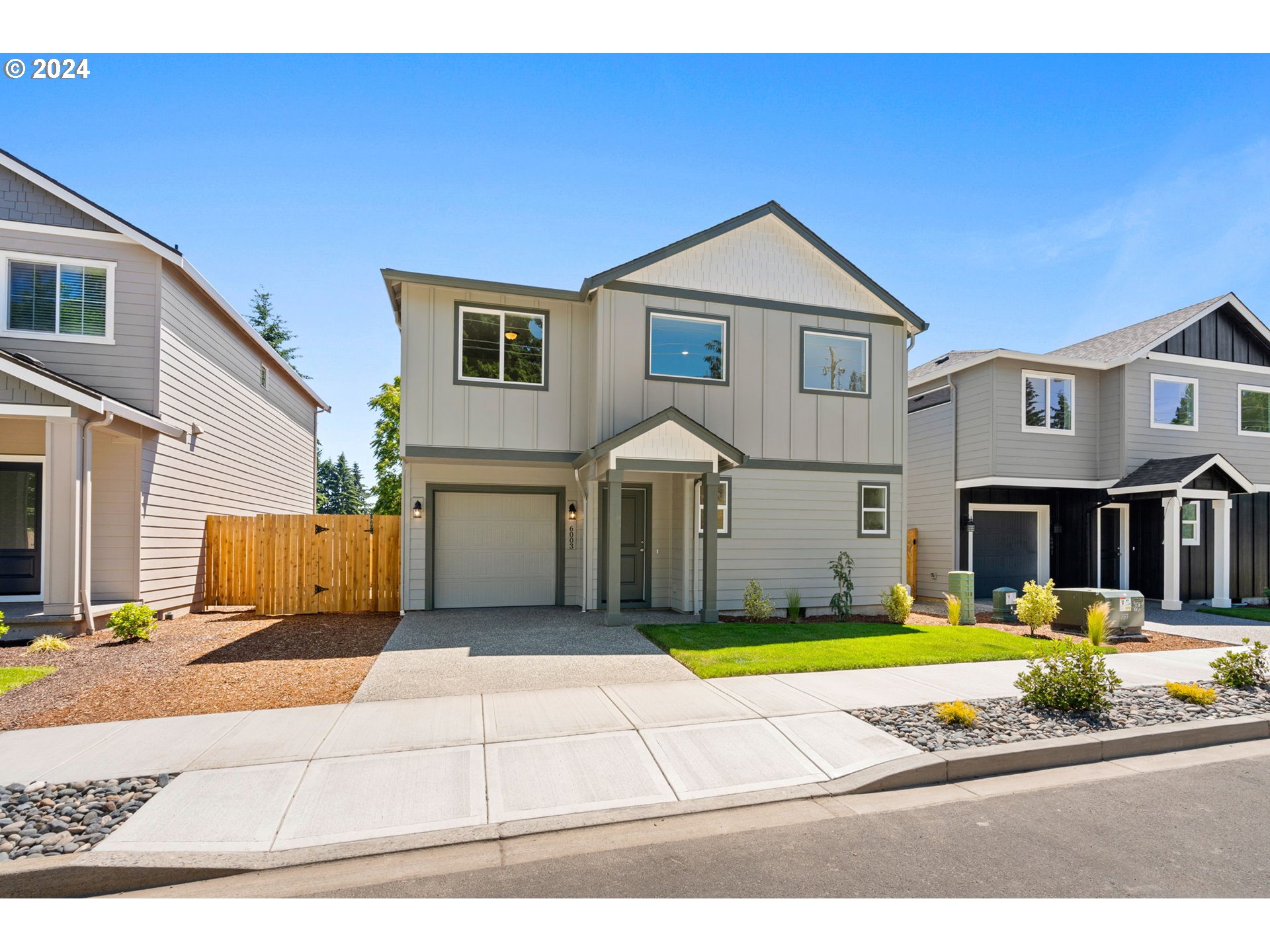 a view of a house with entertaining space and a yard