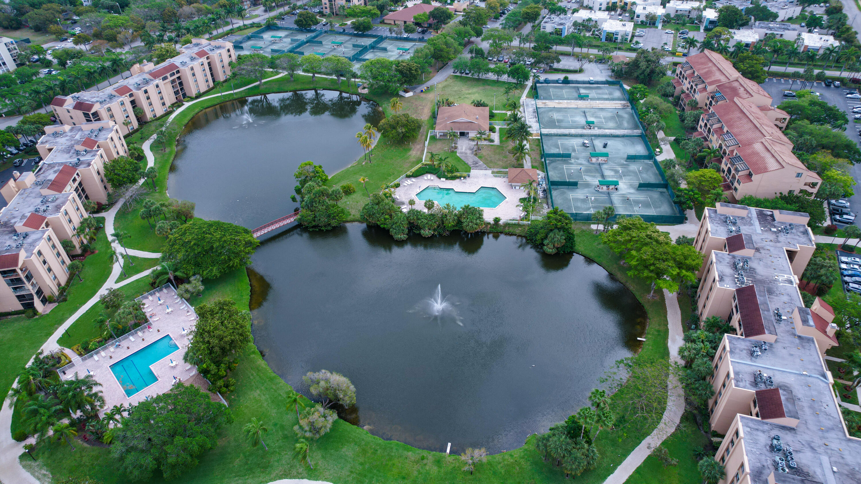 an aerial view of residential house with outdoor space and swimming pool