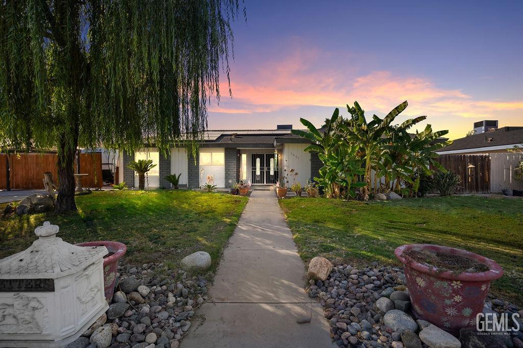 front view of a house with a yard