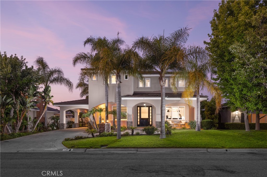 a view of a big yard in front of a house