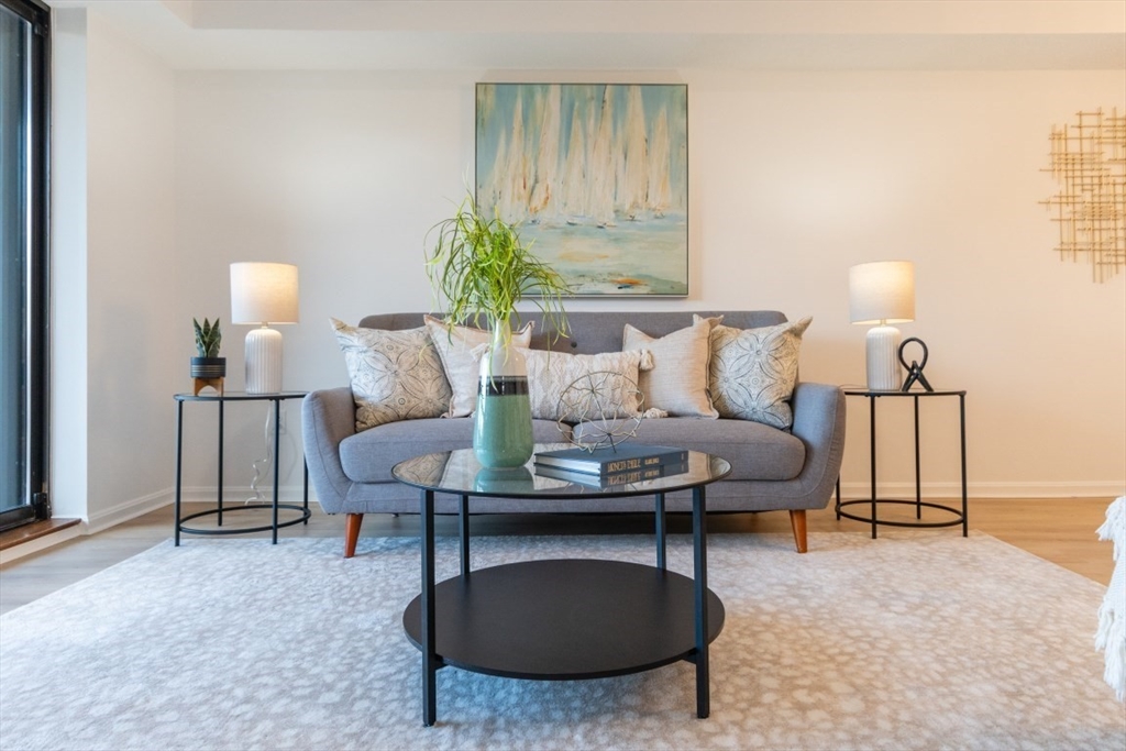 a living room with furniture and a lamp