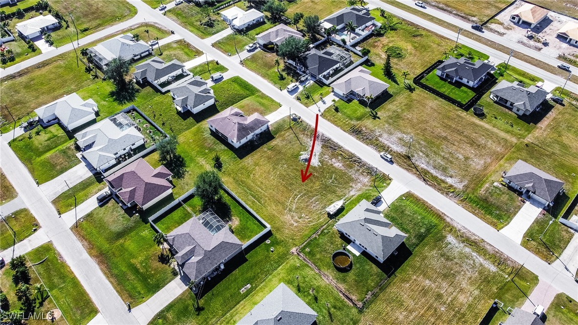 an aerial view of residential house with outdoor space and swimming pool