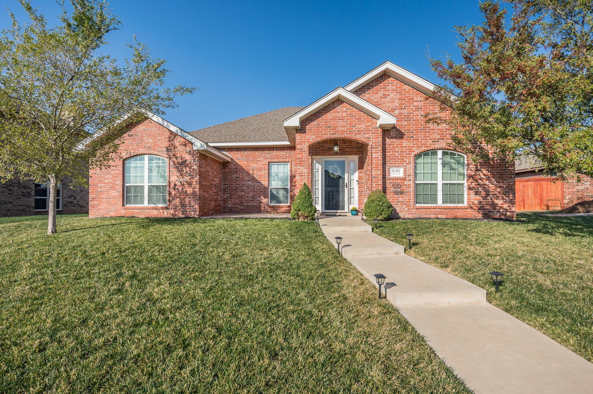 front view of a house with a yard