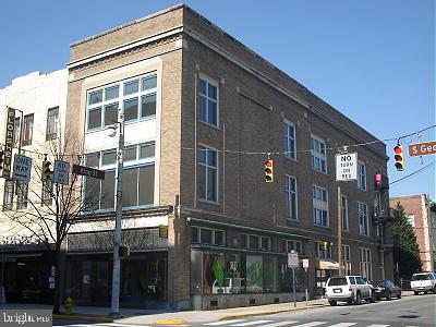 a front view of a building with a street