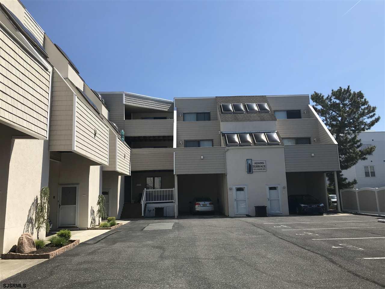 a front view of a building with garage