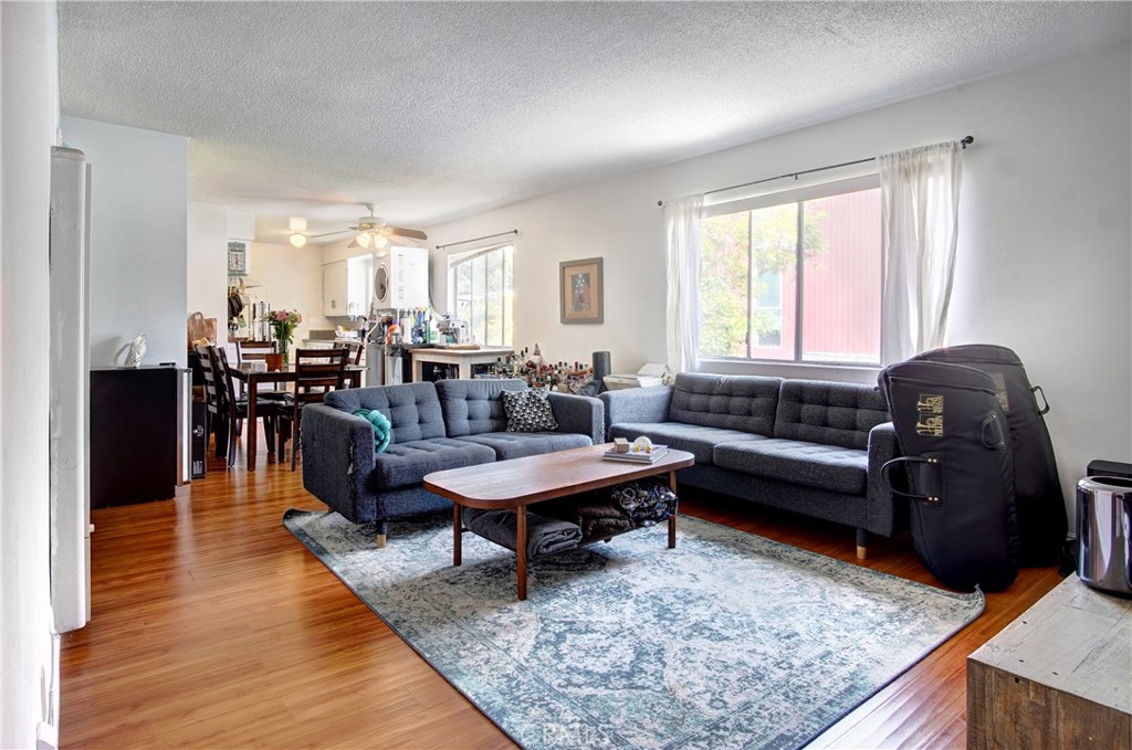 a living room with lots of furniture and a rug