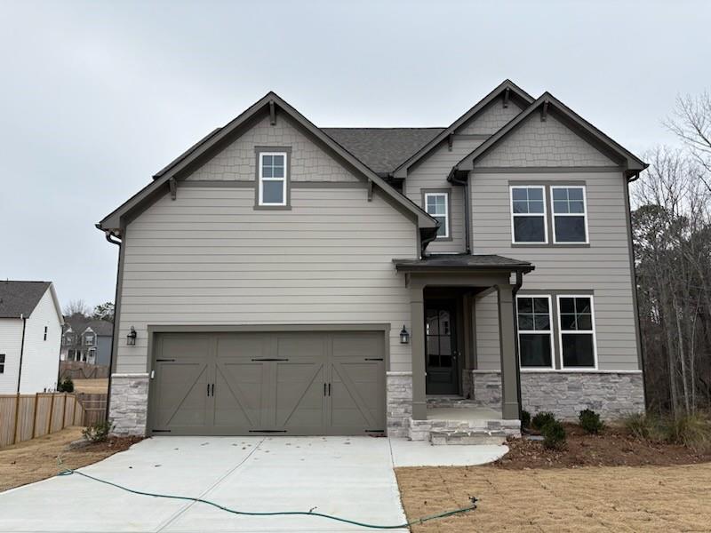 a front view of a house with a garage