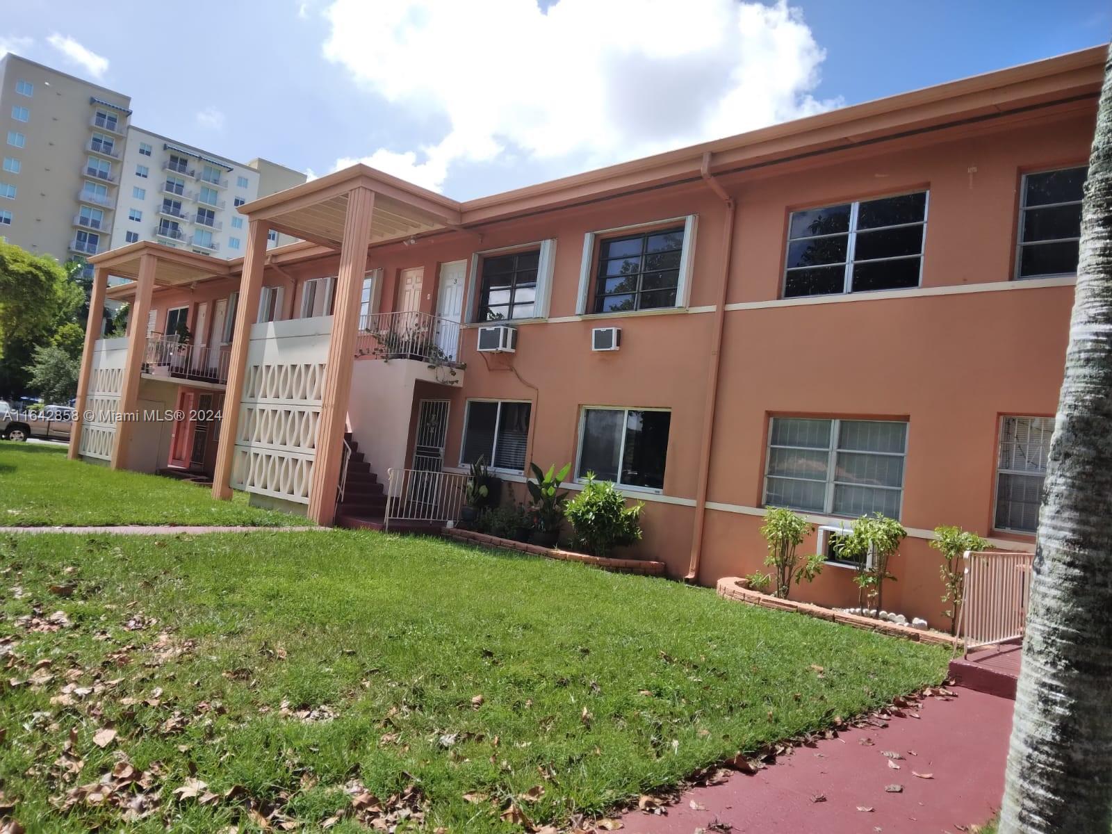 a view of house with backyard