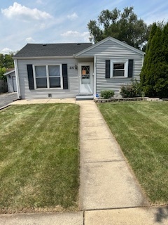 a front view of a house with yard