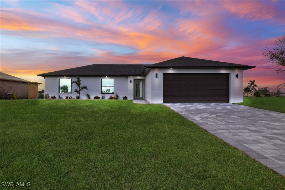 a front view of a house with a yard