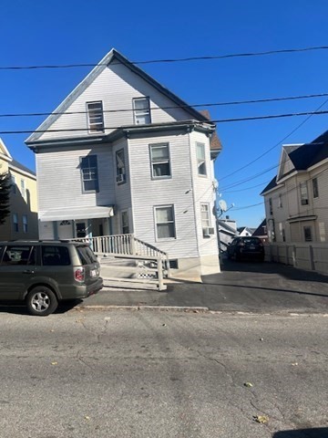 a view of a car park in front of house