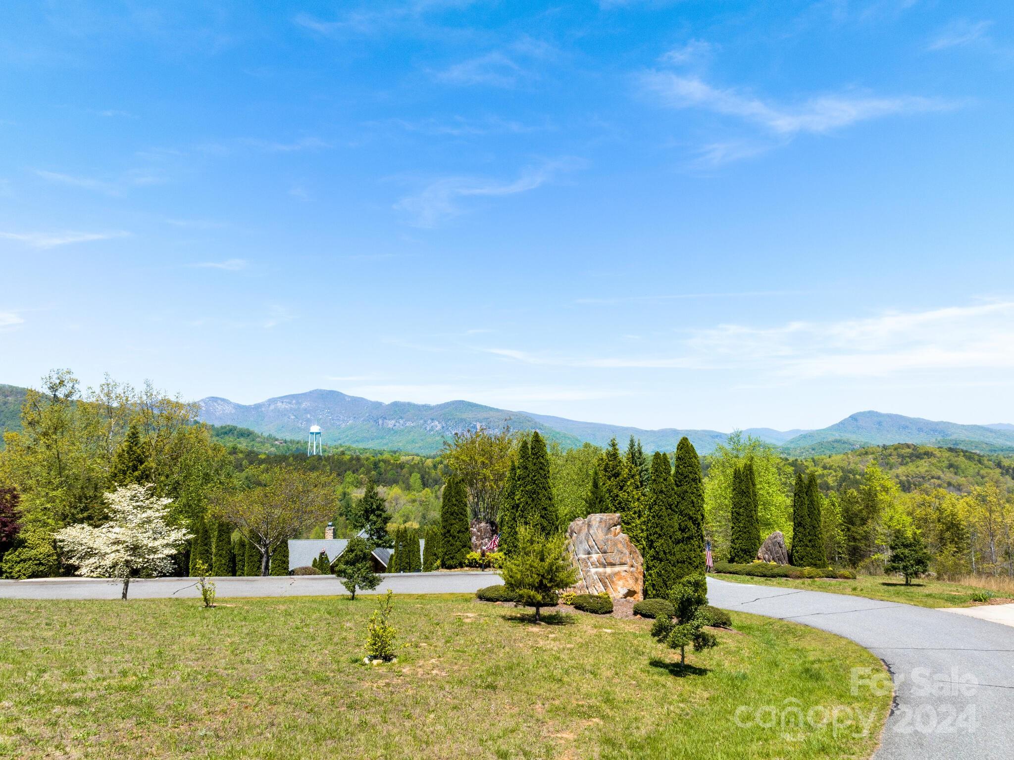 a view of a town with mountains in the background