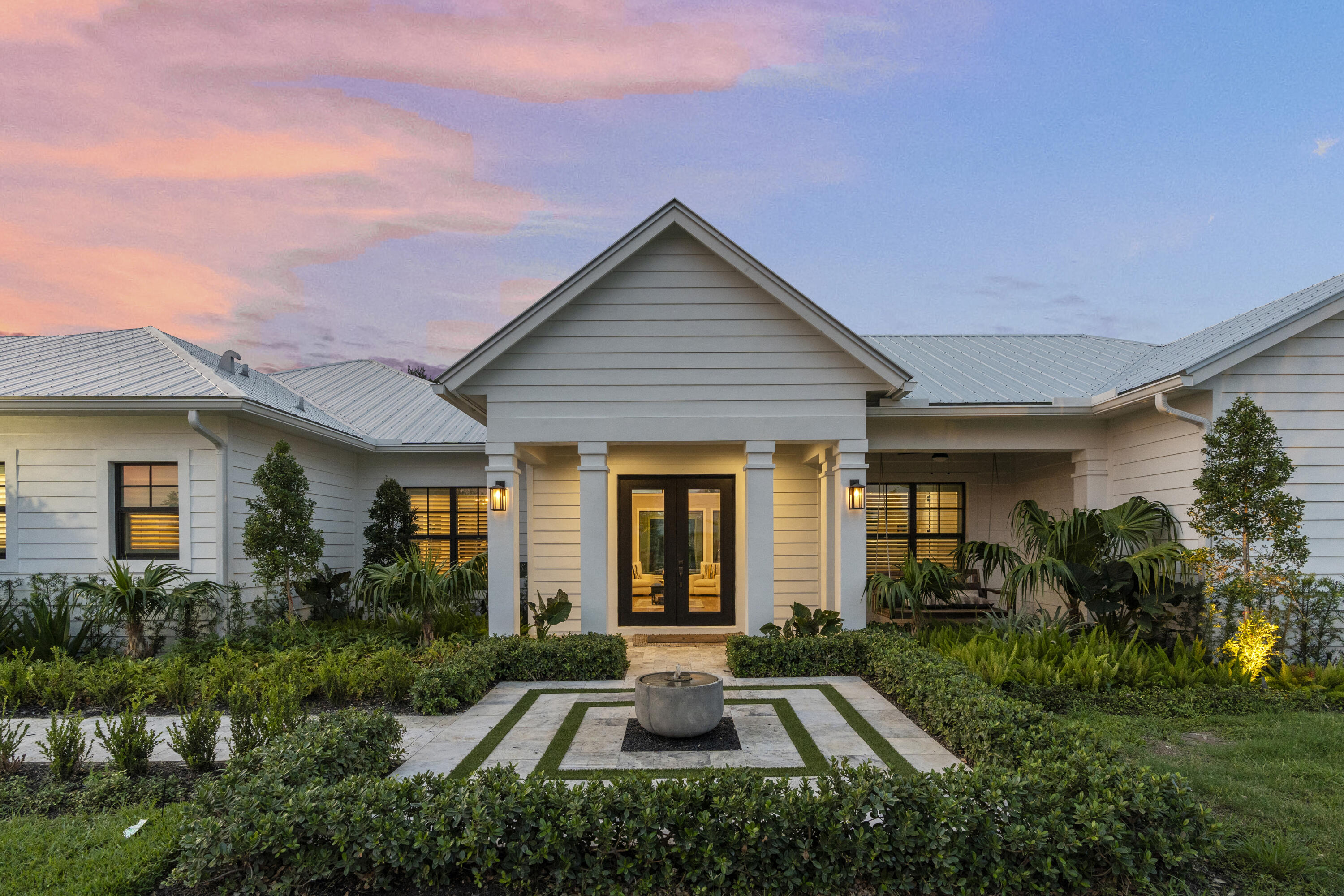 a front view of house with yard and green space