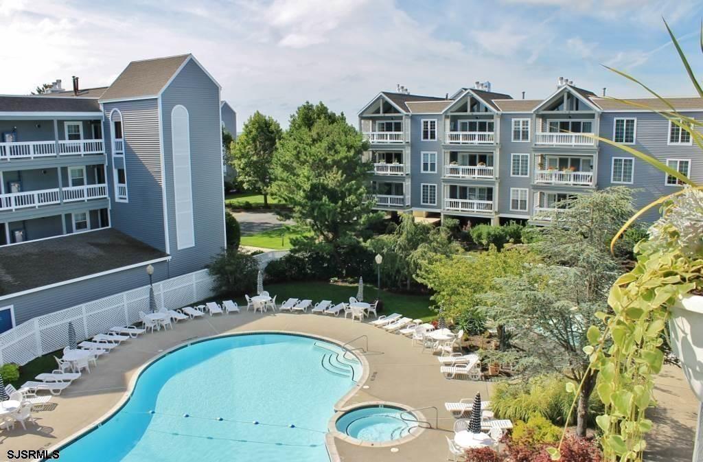 a large building with a swimming pool