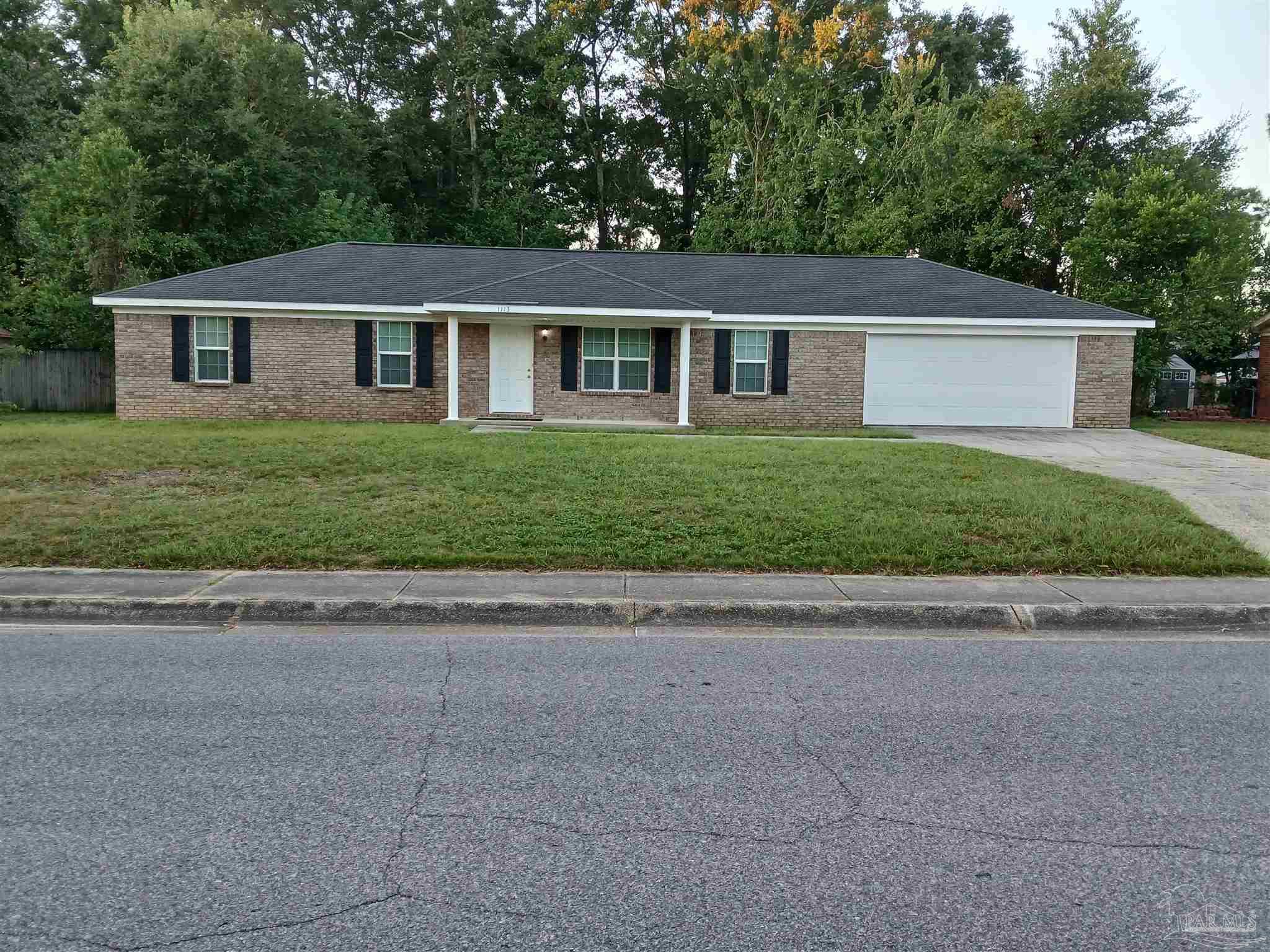 front view of a house and a yard