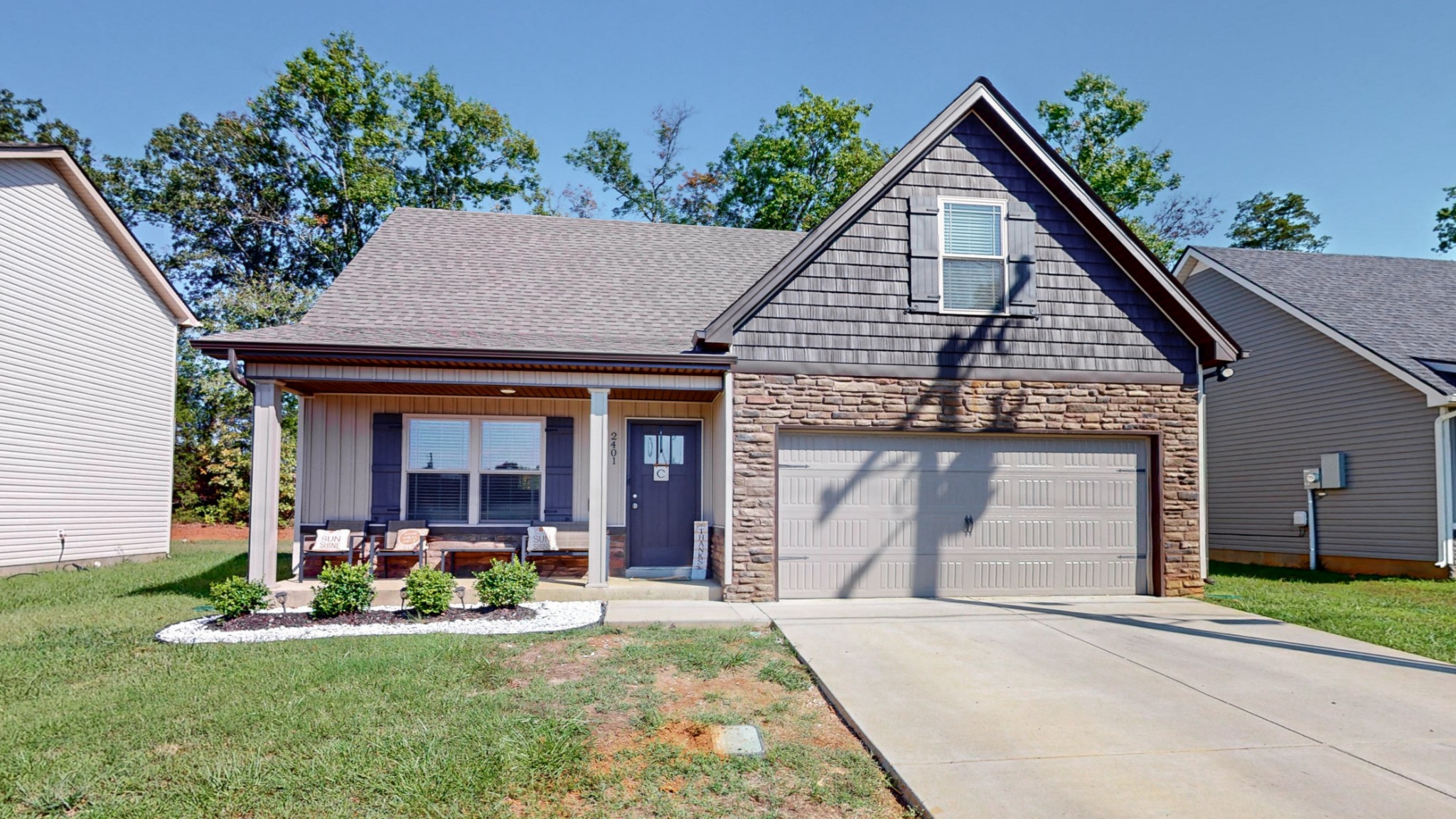 front view of a house with a yard