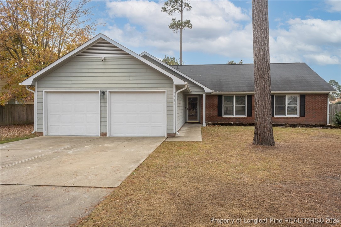 a front view of a house with a garage