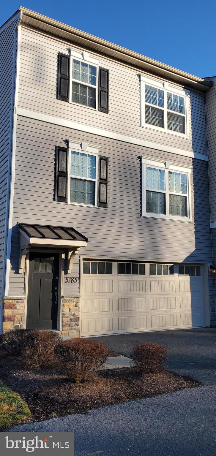 a front view of a house with a garage