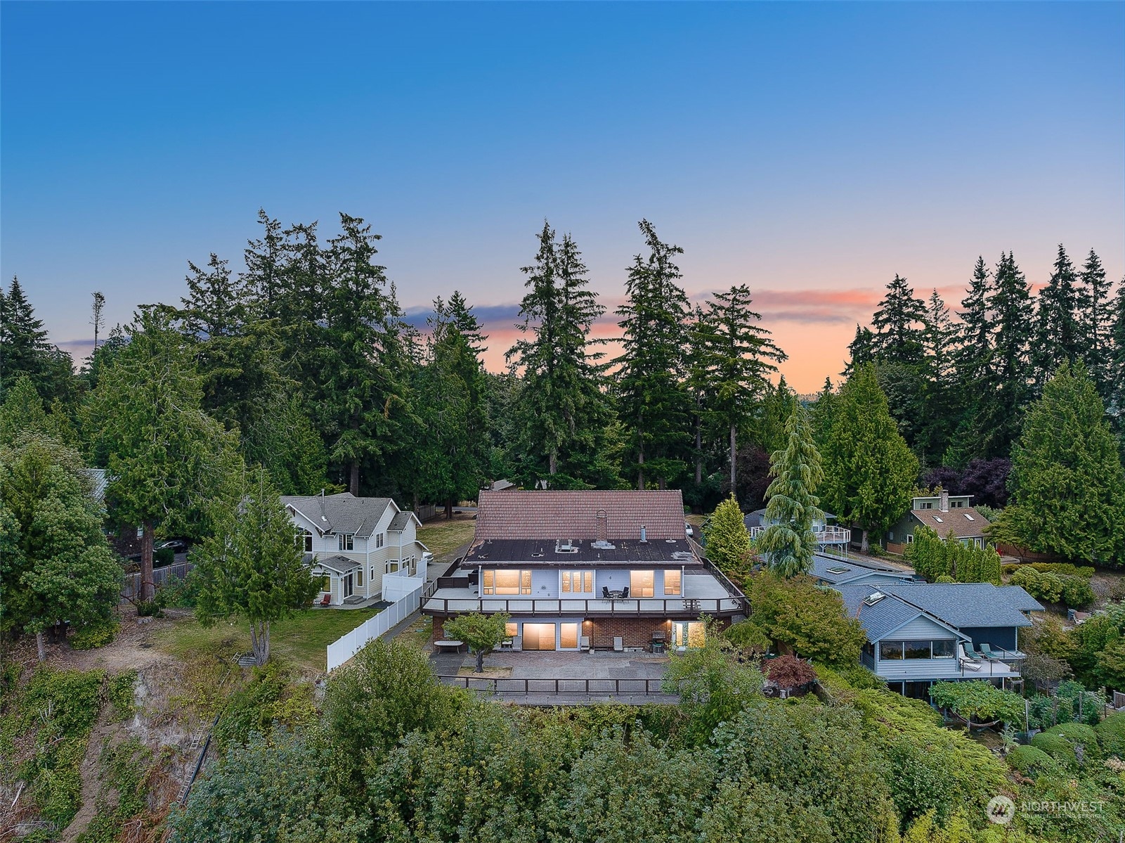 an aerial view of a house with yard and outdoor seating