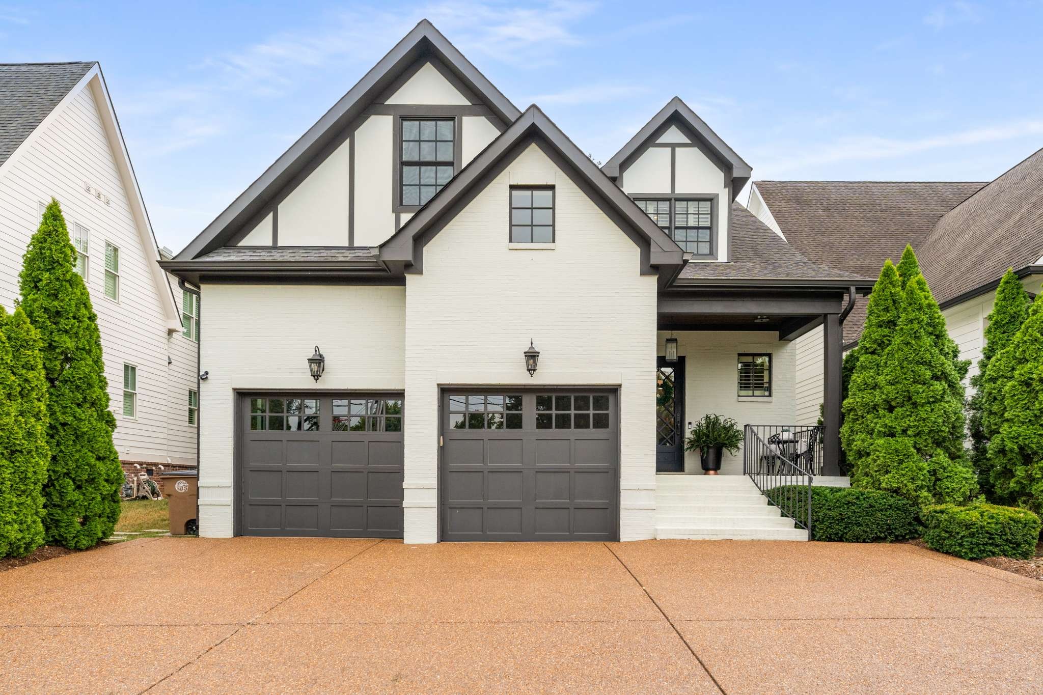 a front view of a house with garage