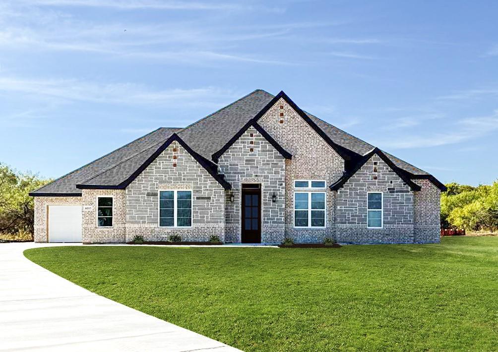 front view of a house with a yard