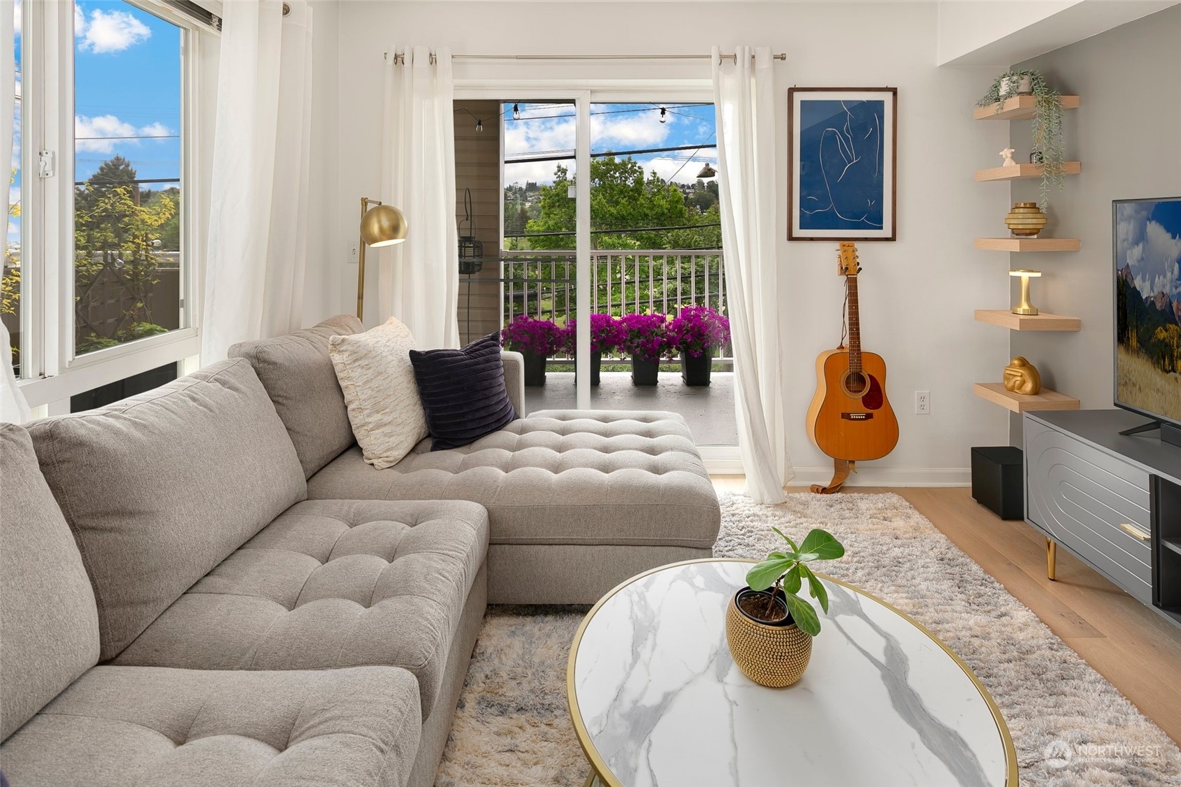 a living room with furniture and a large window