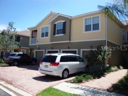 a front view of a house with parking space