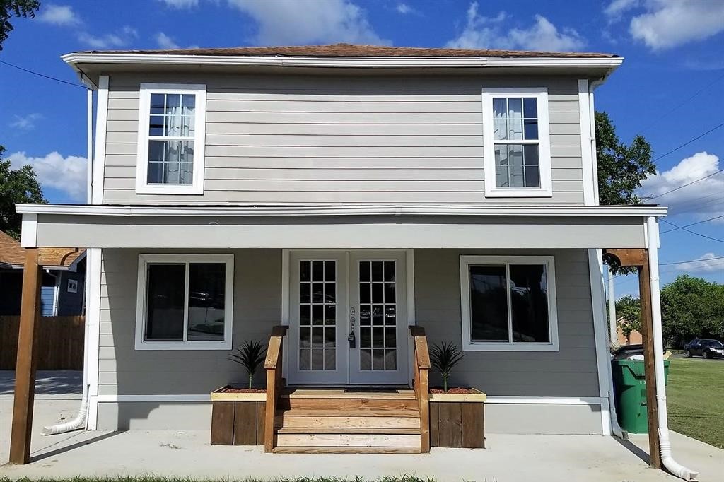 a front view of a house with a porch