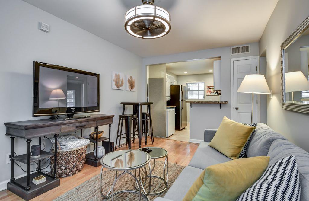 a living room with furniture and a flat screen tv