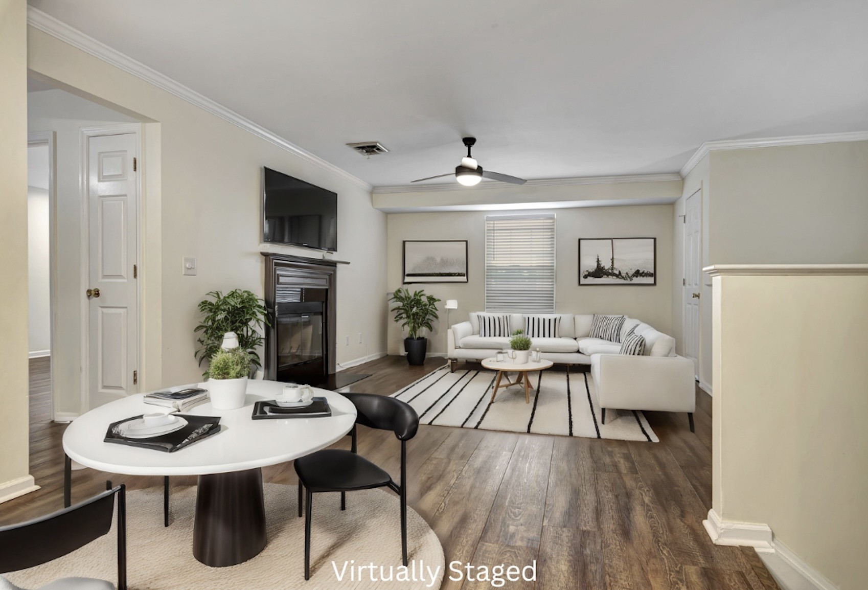 a view of a dining room with furniture and wooden floor