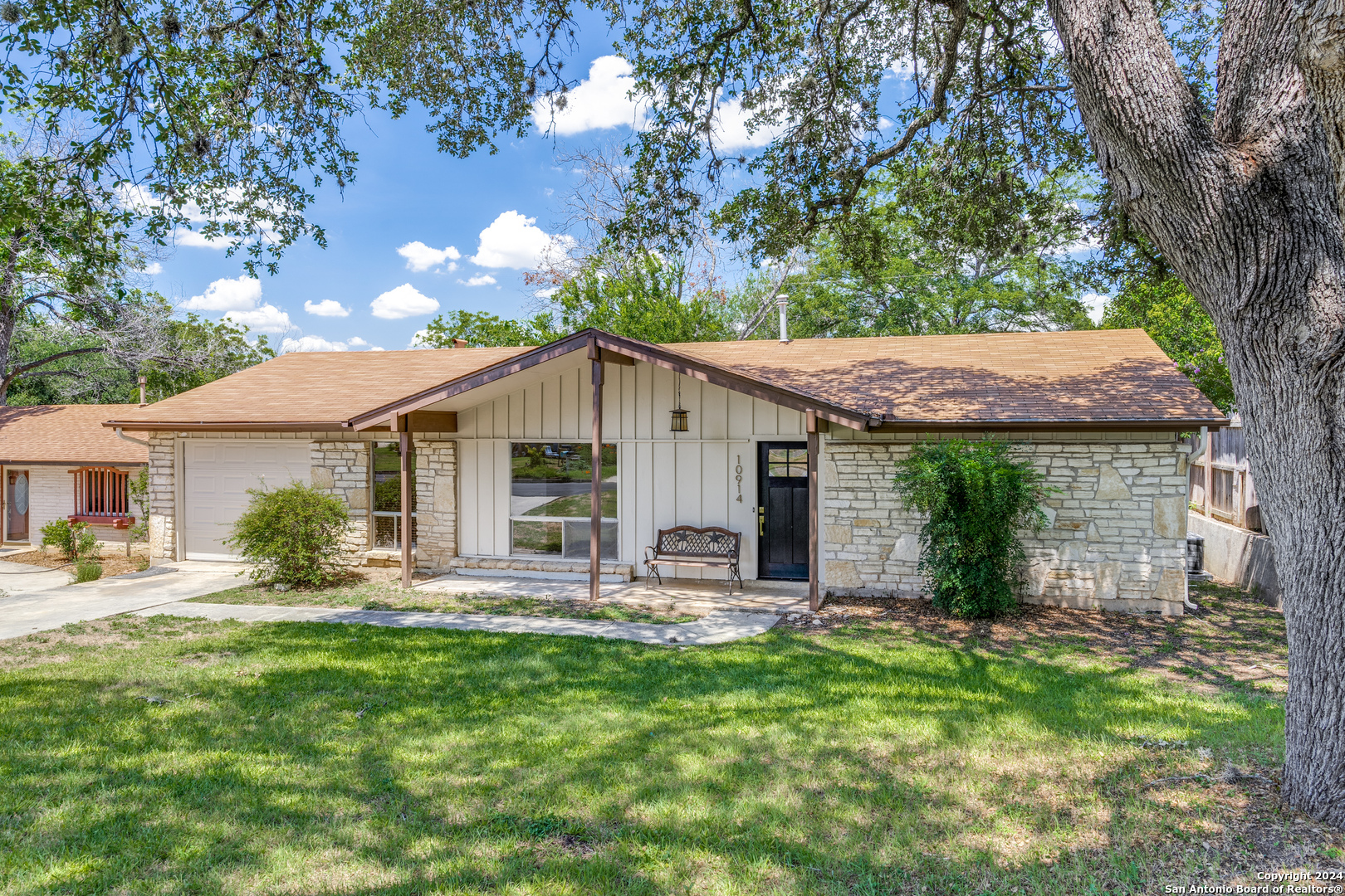 a front view of house with yard and seating area