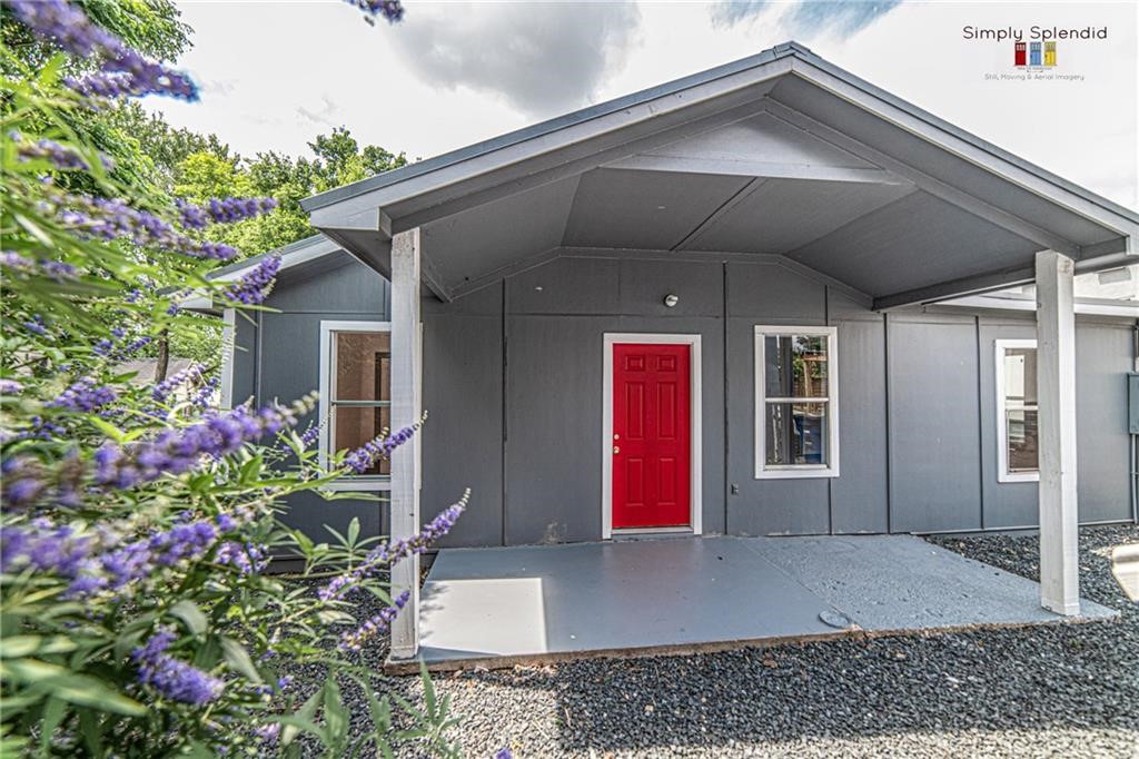 a front view of house with an outdoor space