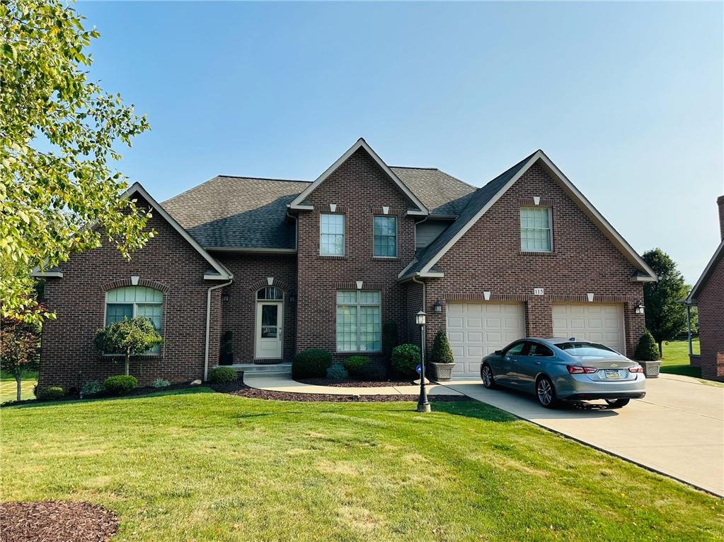 a front view of house with yard and outdoor seating