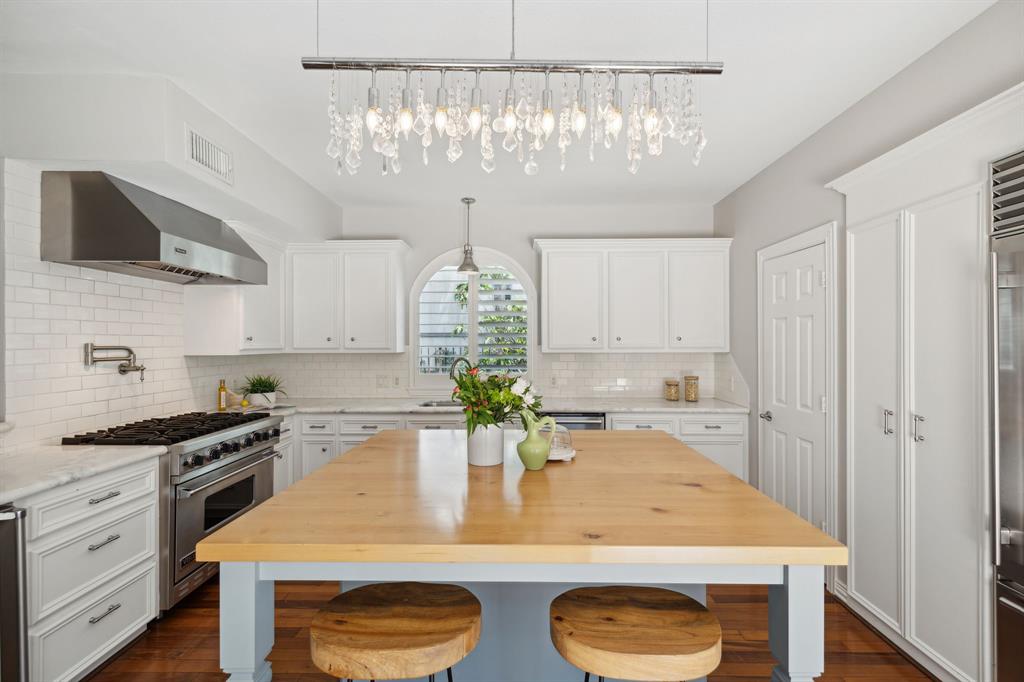 a kitchen with a table and chairs in it