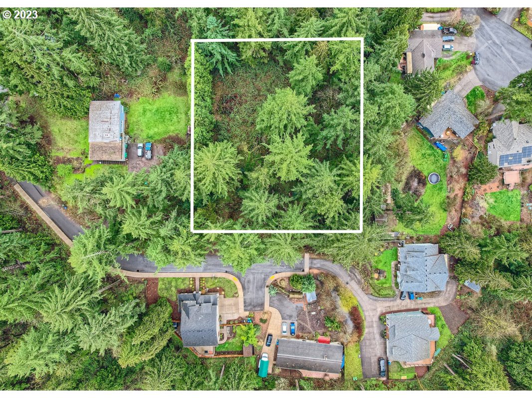 an aerial view of house with a yard