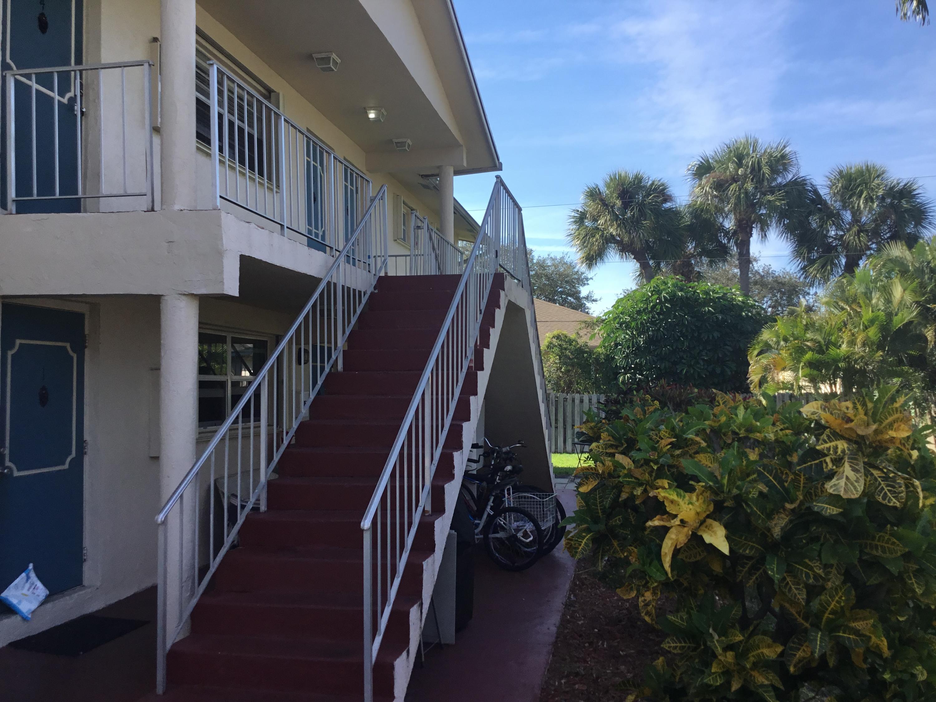 a view of entryway with wooden stairs