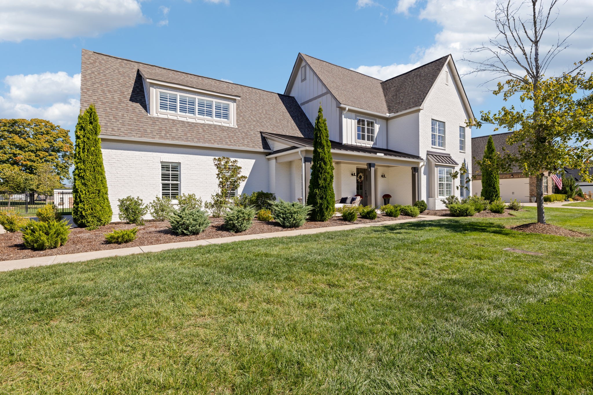 a front view of house with yard and green space