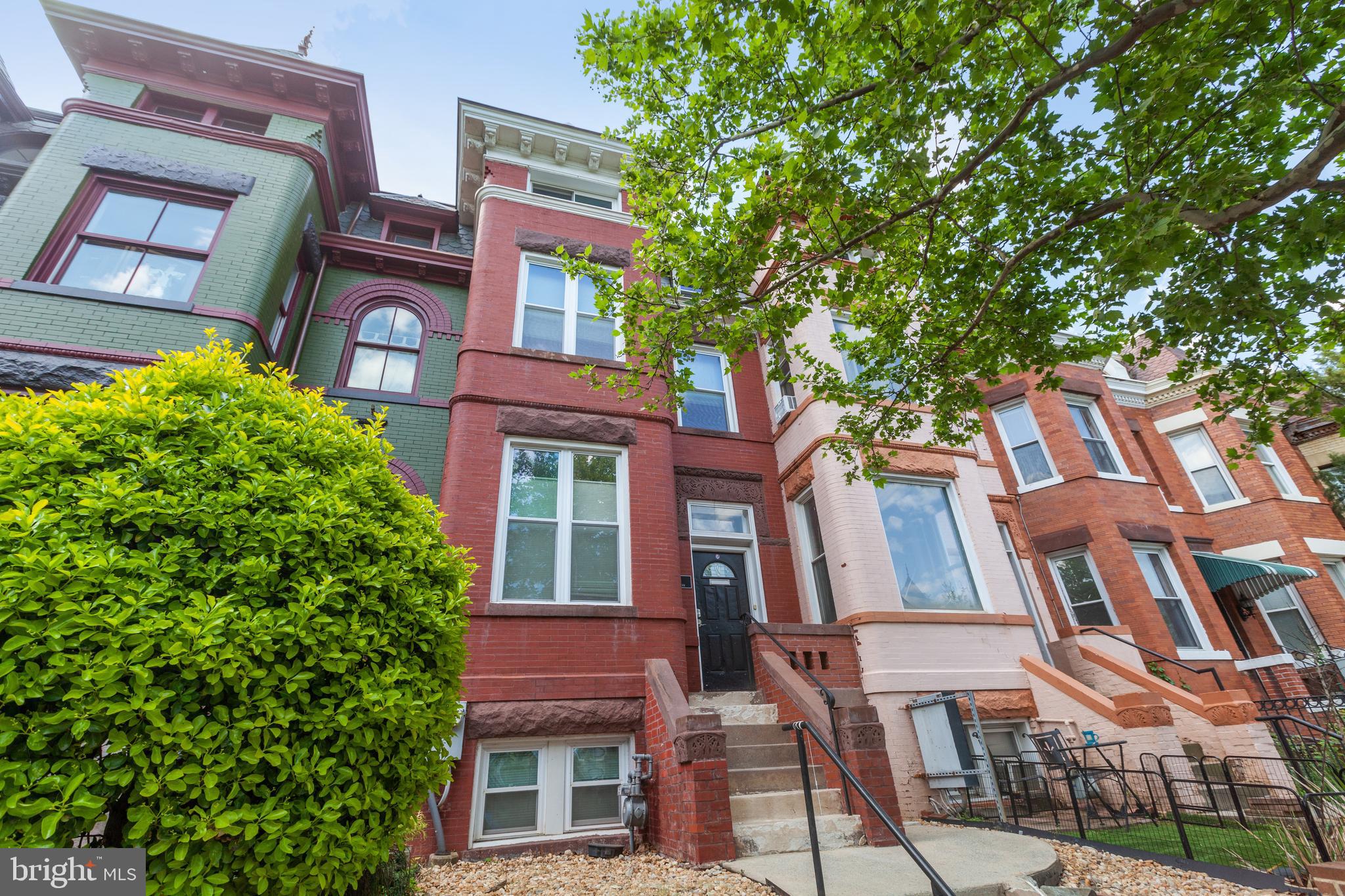 a front view of a multi story residential apartment buildings