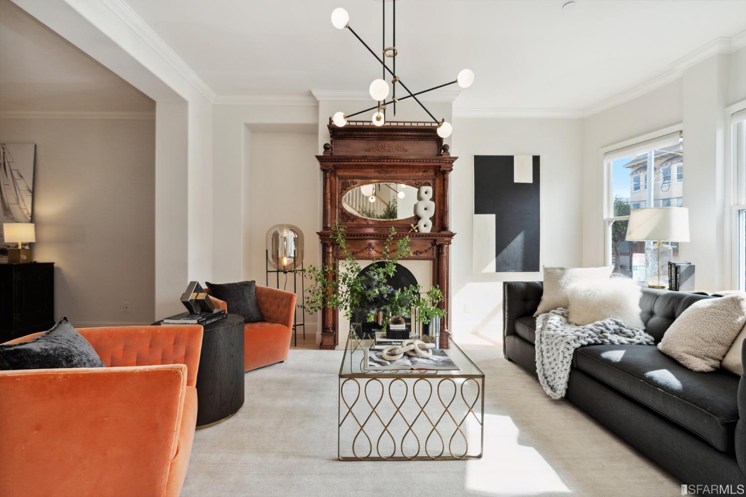 a living room with furniture and a chandelier