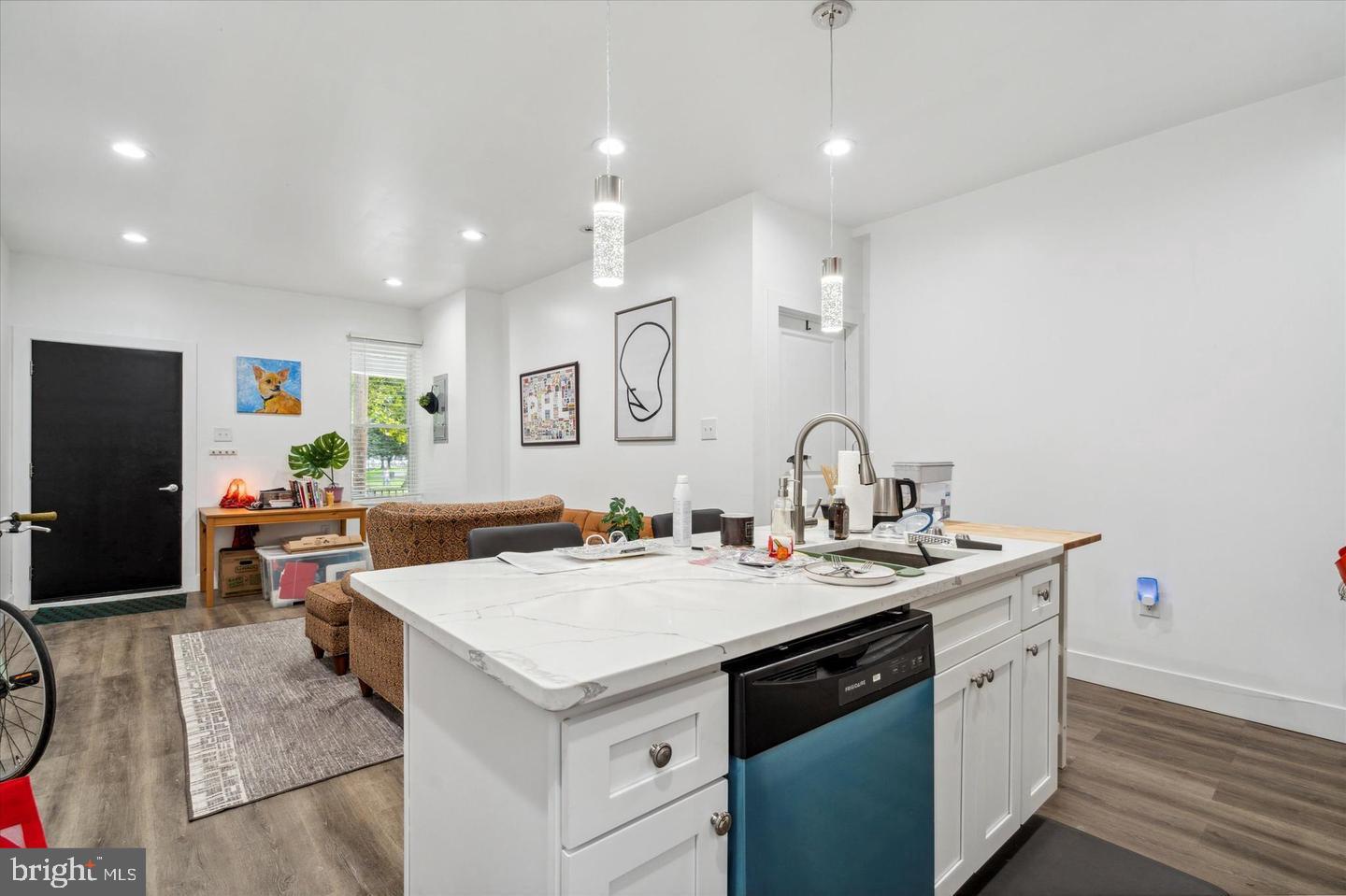 a view of kitchen with sink microwave and stove