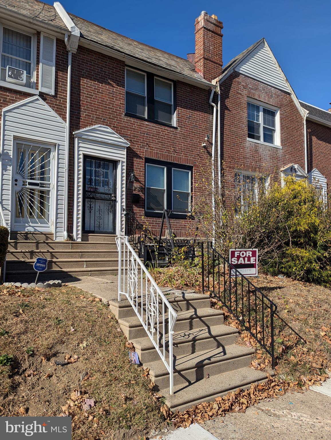 a front view of a house with street