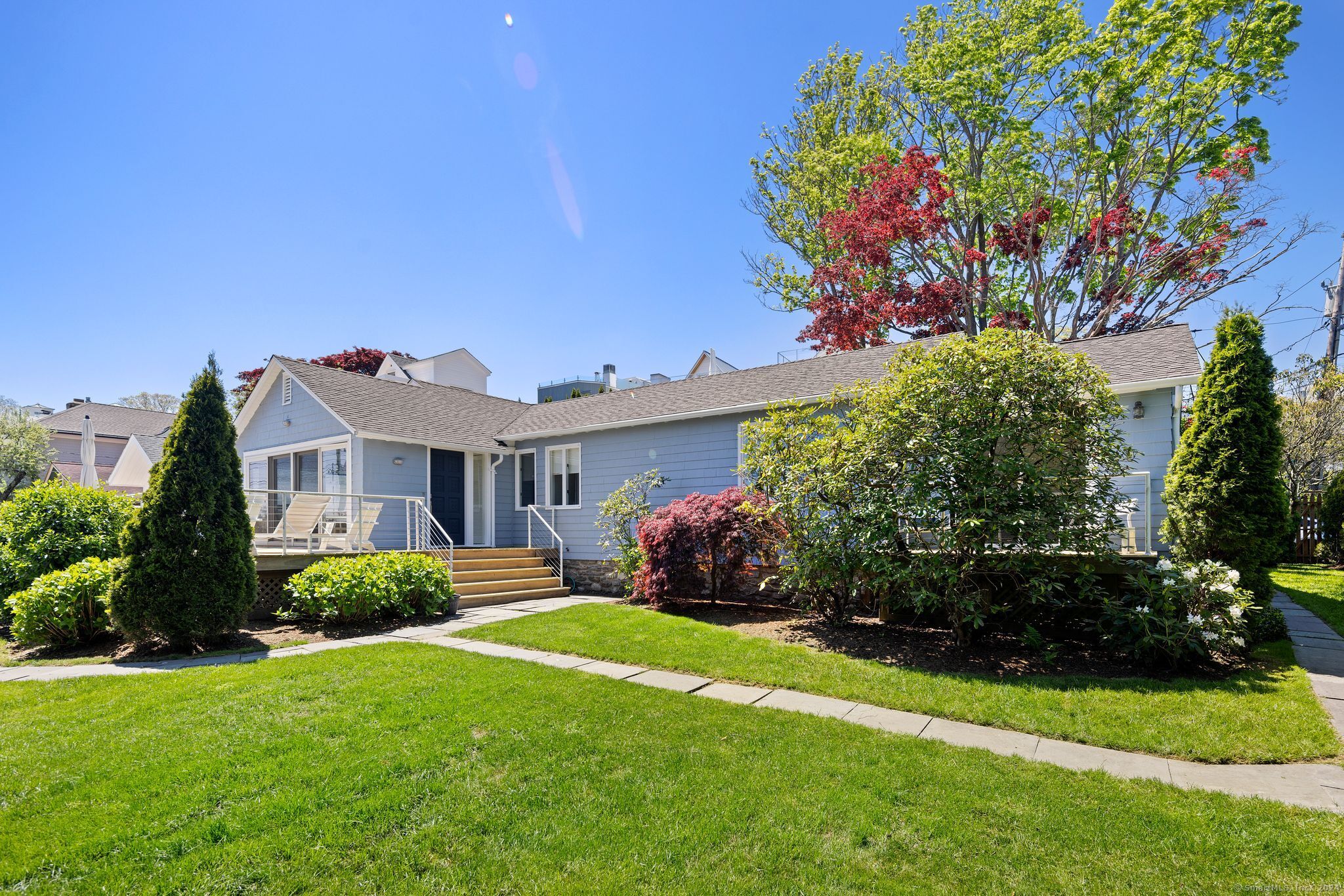 a front view of a house with a yard