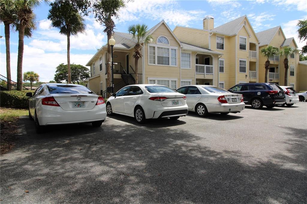 a view of a cars park in front of a house