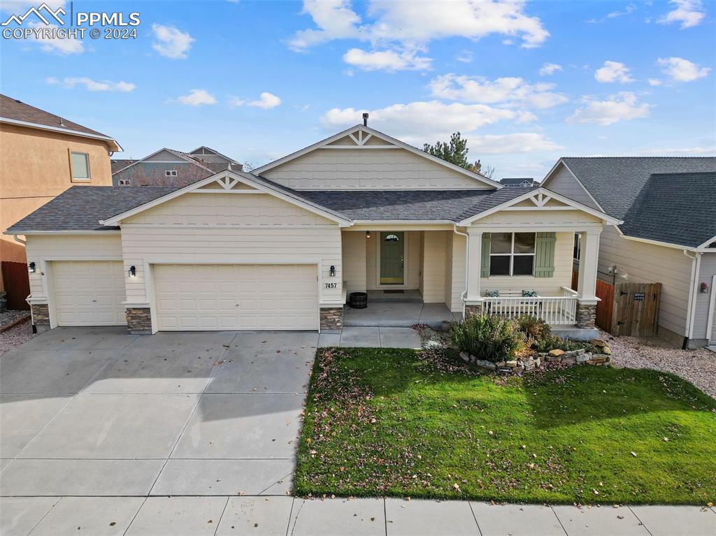 front view of a house with a yard