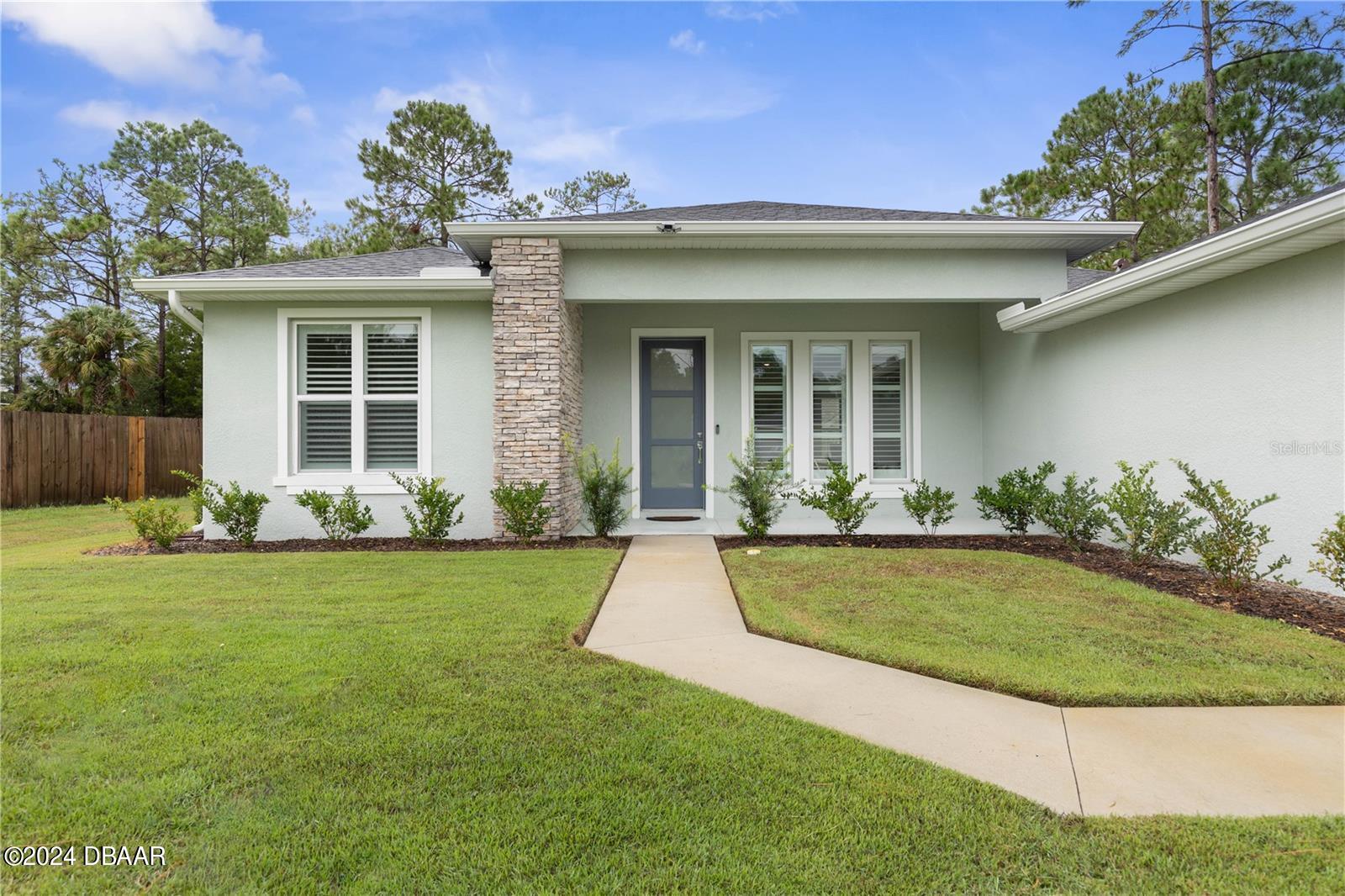 front view of a house with a yard