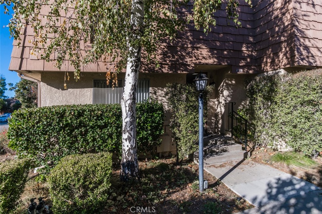 a view of a tree in front of a house