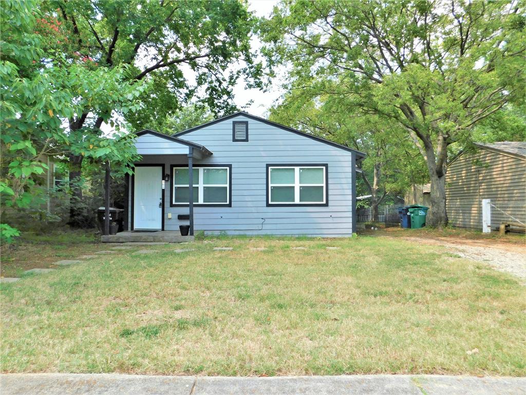 a house with trees in the background